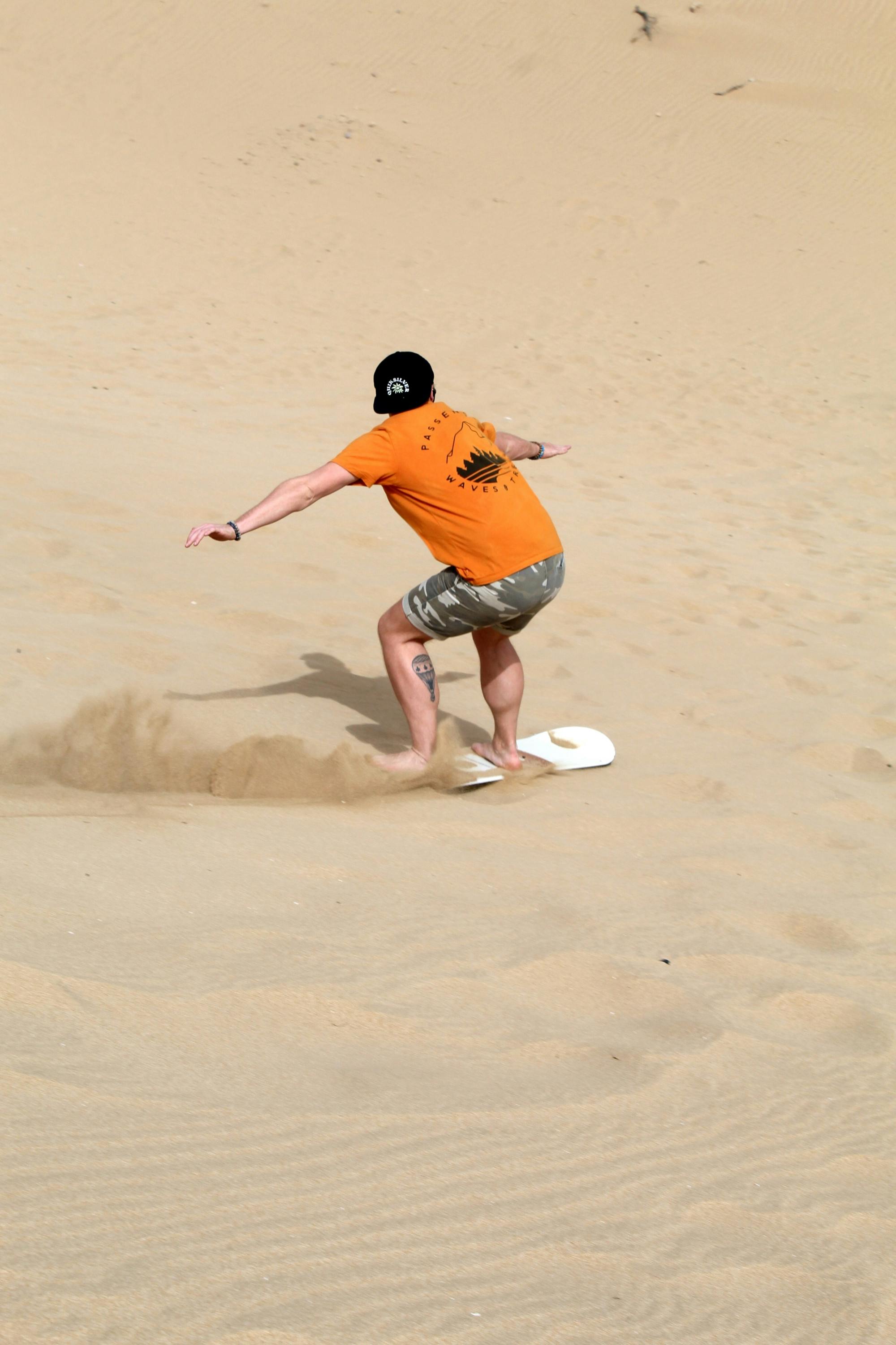 Sandboarding - Sand surfing