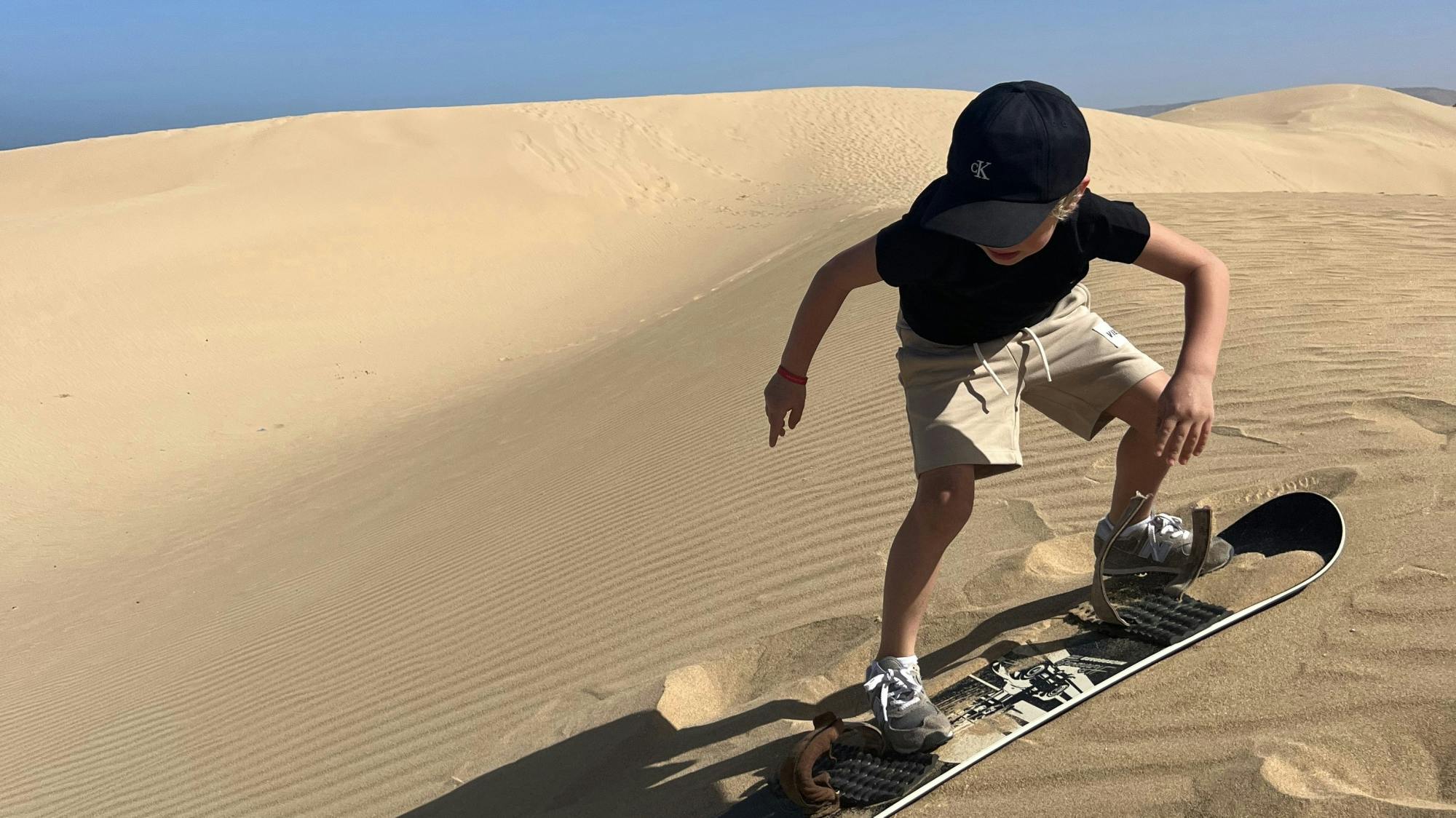 Half-day camel ride and sandboarding adventure