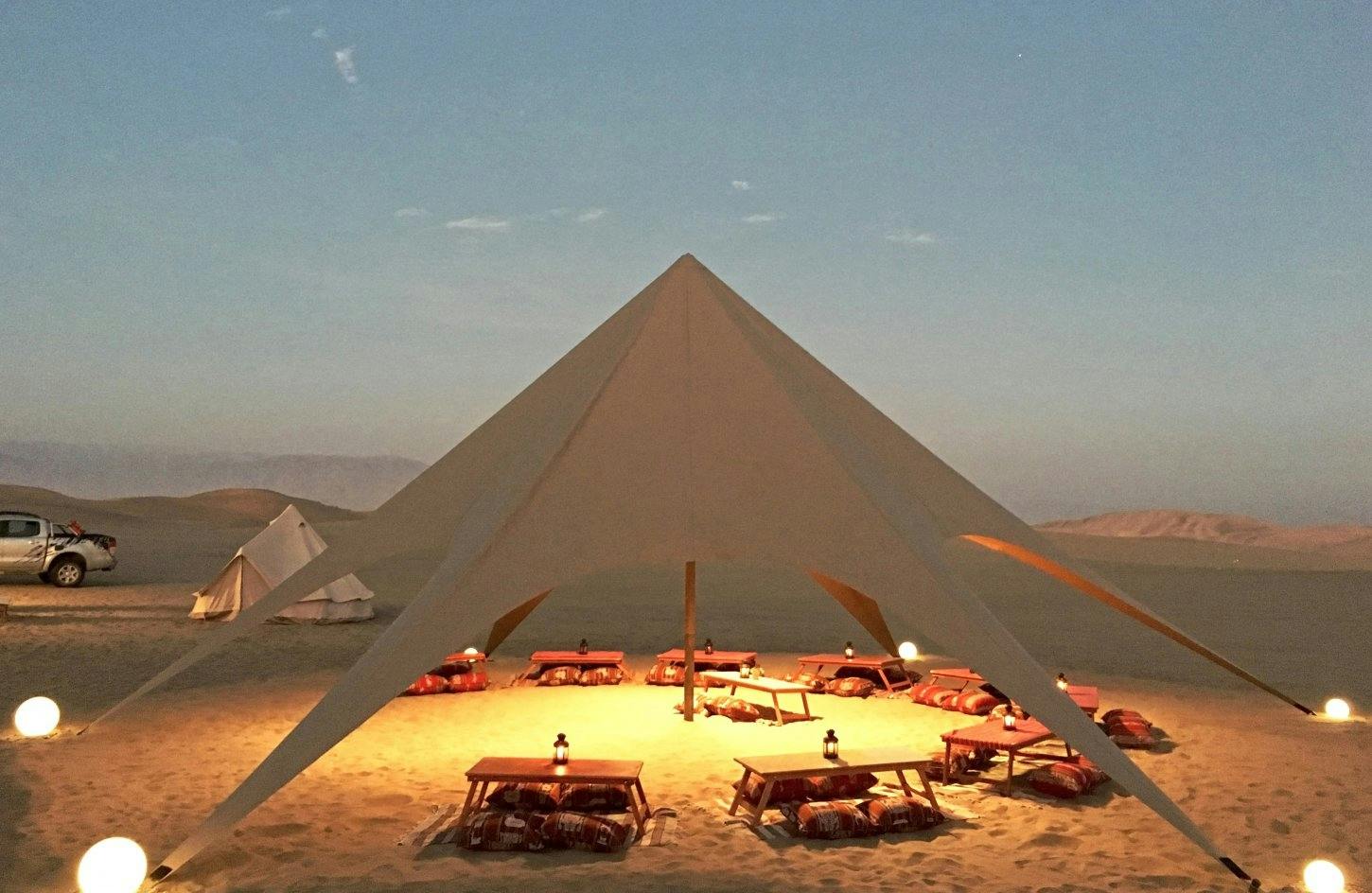 Huacachina desert glamping experience with dinner and sandboarding