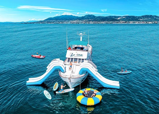 Benalmadena boat tour with XXL slide, snorkelling and water activities
