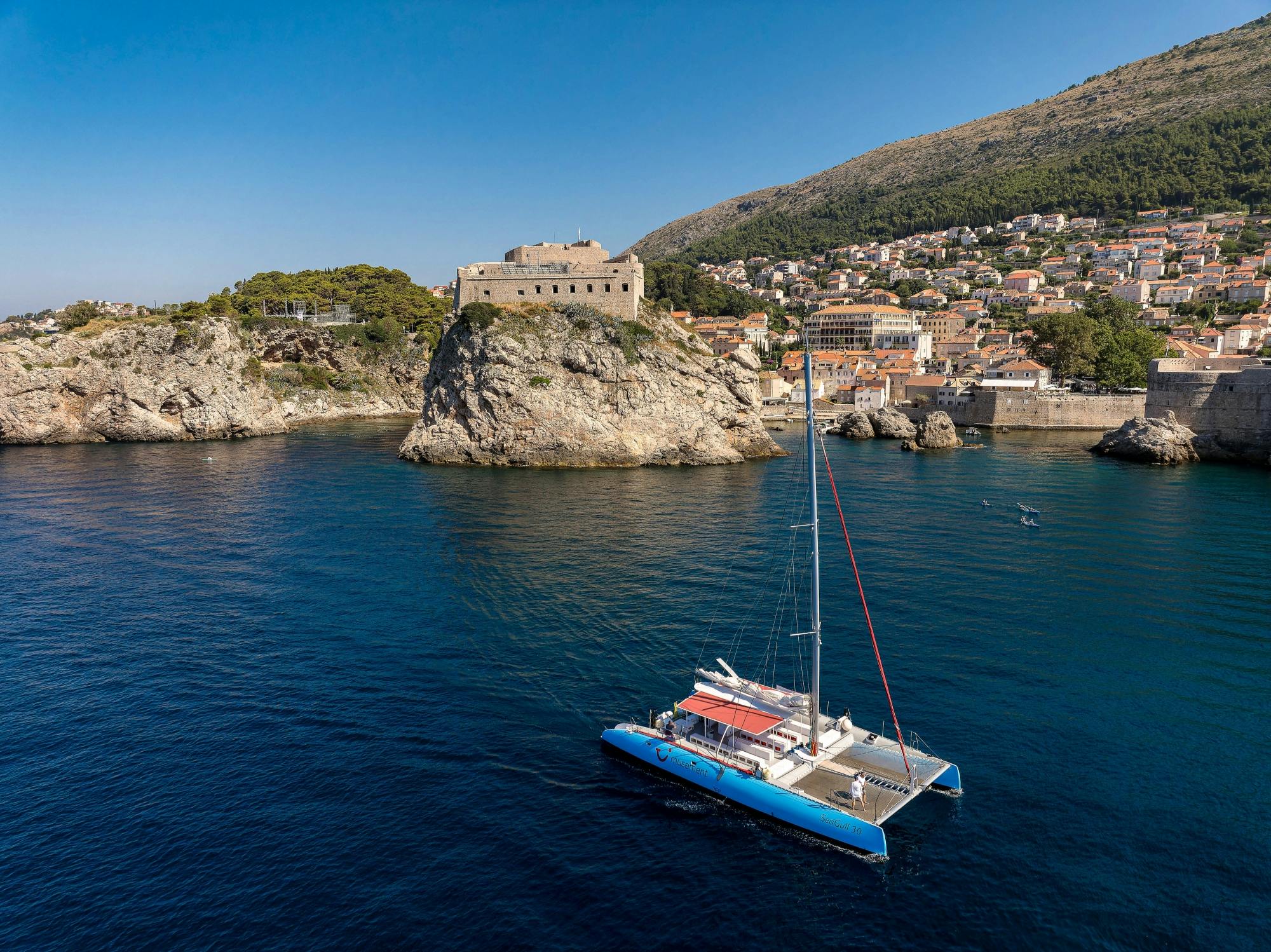 Corfu east coast catamaran cruise with drinks, snacks and optional transfers