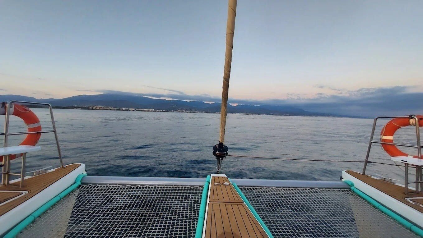 Sunset catamaran cruise from Caleta Velez