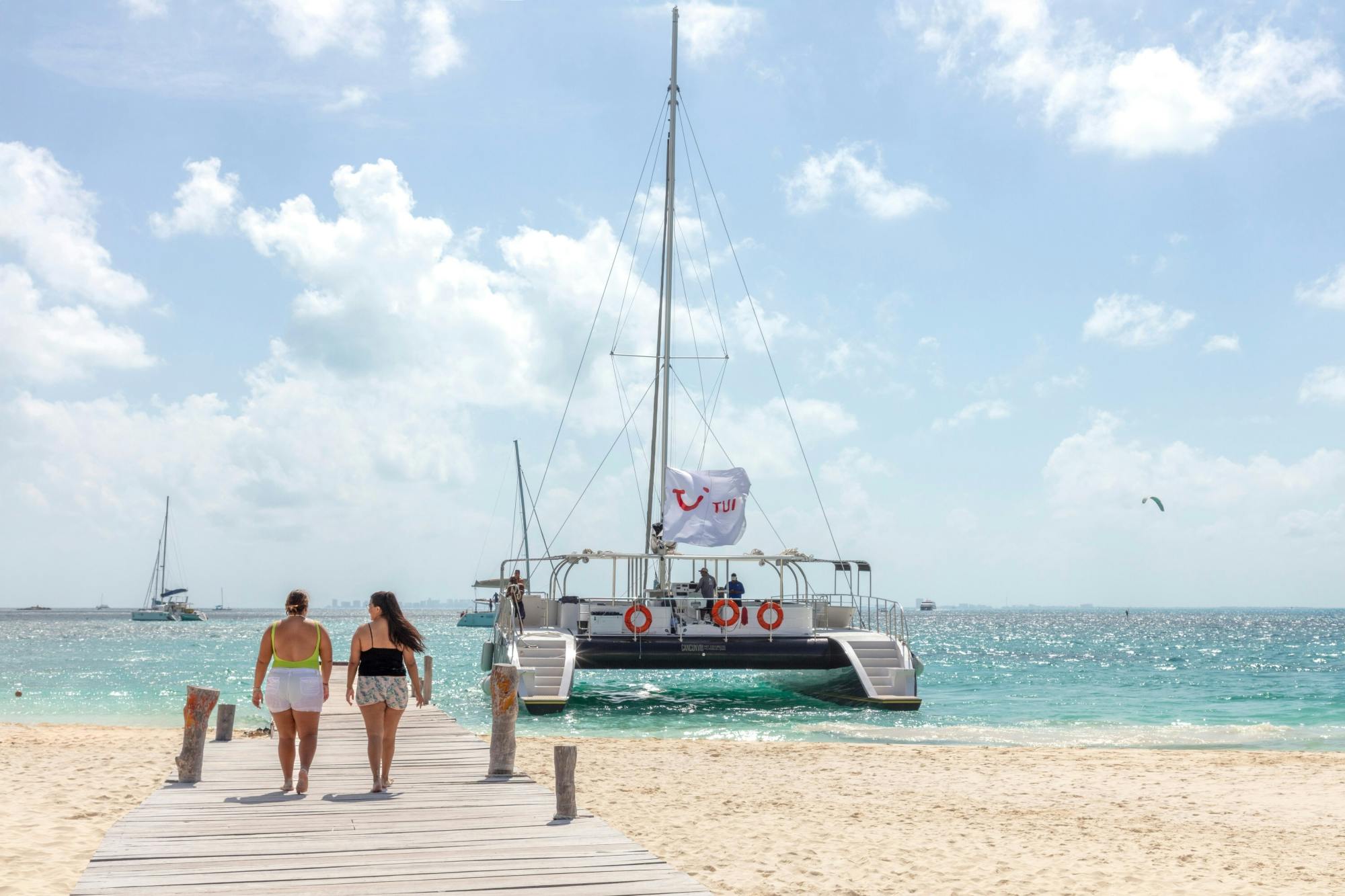 Catamaran cruise to Isla Mujeres with beach club visit and brunch
