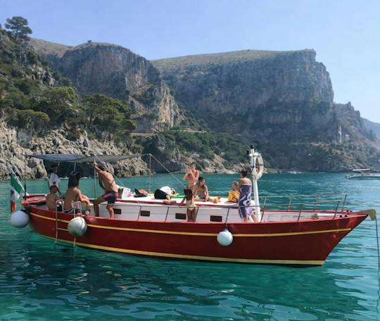 Gozzo boat tour in Naples with swimming stop and local tasting