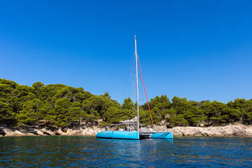 Corfu east coast catamaran cruise with drinks, meal and optional transfers