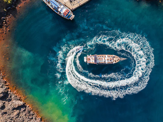 Volcanic islands sunset dinner cruise in Santorini
