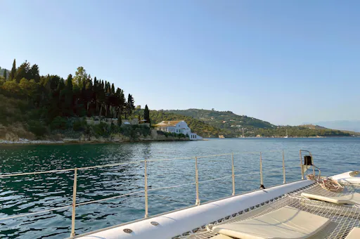 Corfu east coast catamaran cruise with drinks, meal and optional transfers