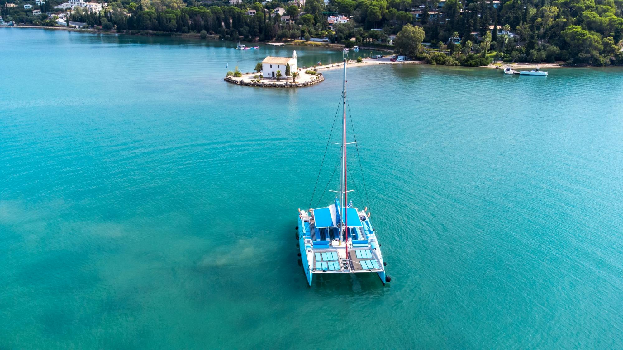 Corfu east coast catamaran cruise with drinks, meal and optional transfers