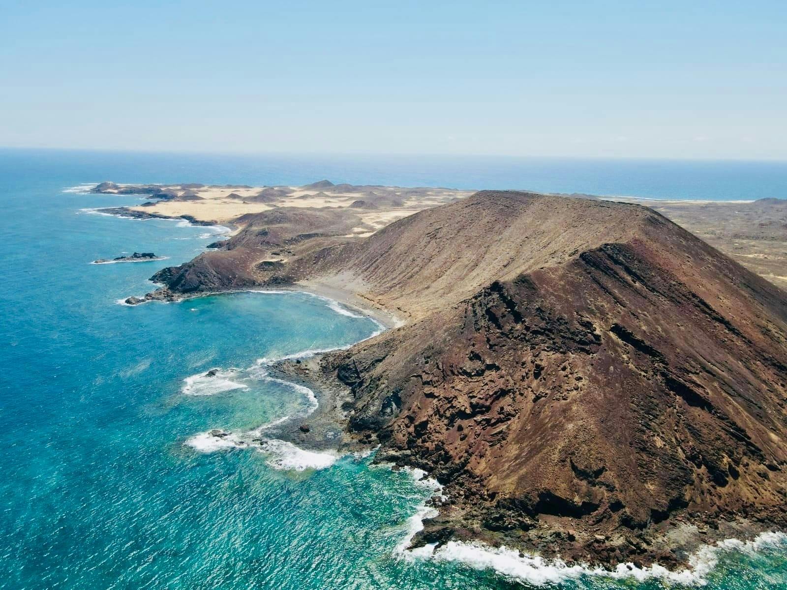 Small group guided tour of Lobos Island by fast ferry, Popcorn Beach and Corralejo Dunes