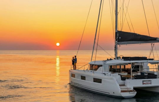 Santorini catamaran cruise with BBQ and drinks from Vlychada Marina