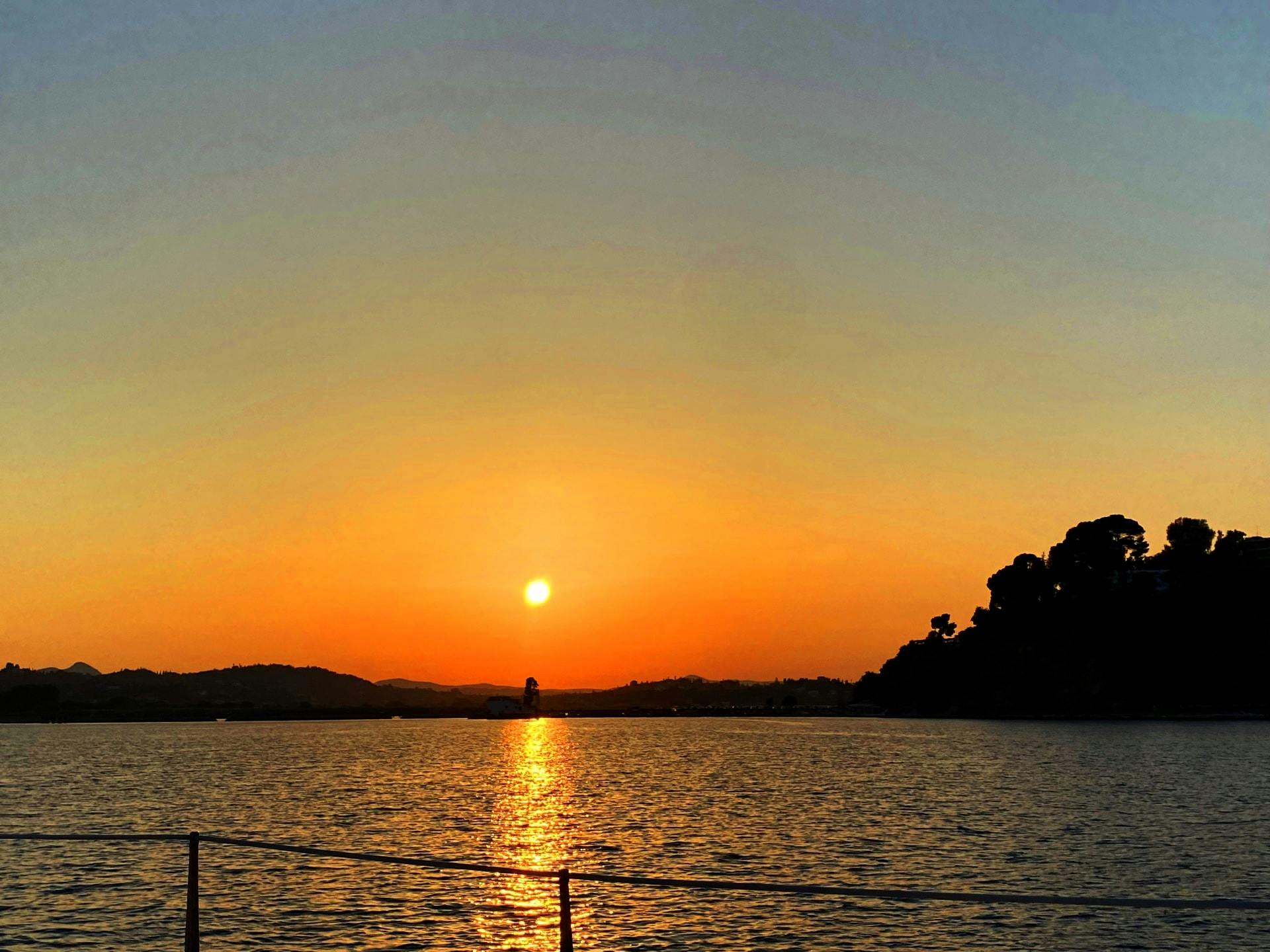 Corfu adults-only sunset catamaran cruise with drinks and optional transfers