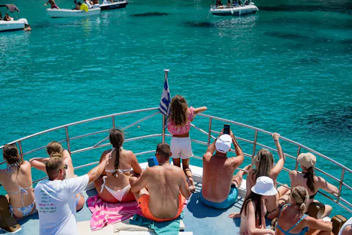 Boat trip from Corfu to Sivota with local lunch, Blue Lagoon and optional transfers