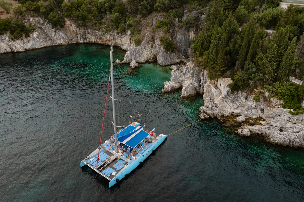Corfu east coast catamaran cruise with drinks, meal and optional transfers
