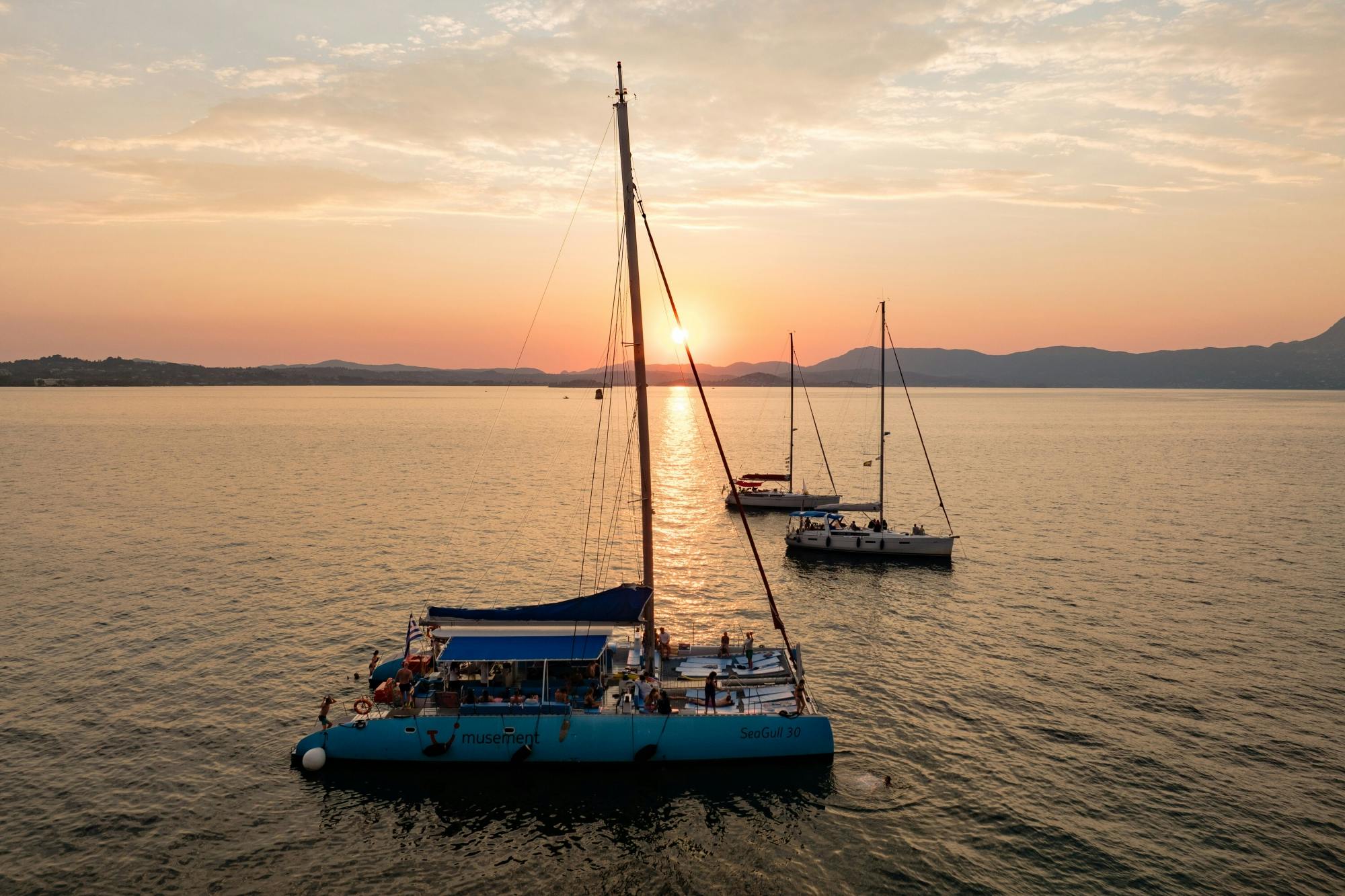 Adults-only Corfu sunset catamaran cruise with drinks, dinner and optional transfers