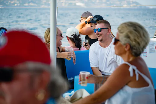 Corfu east coast catamaran cruise with drinks, meal and optional transfers