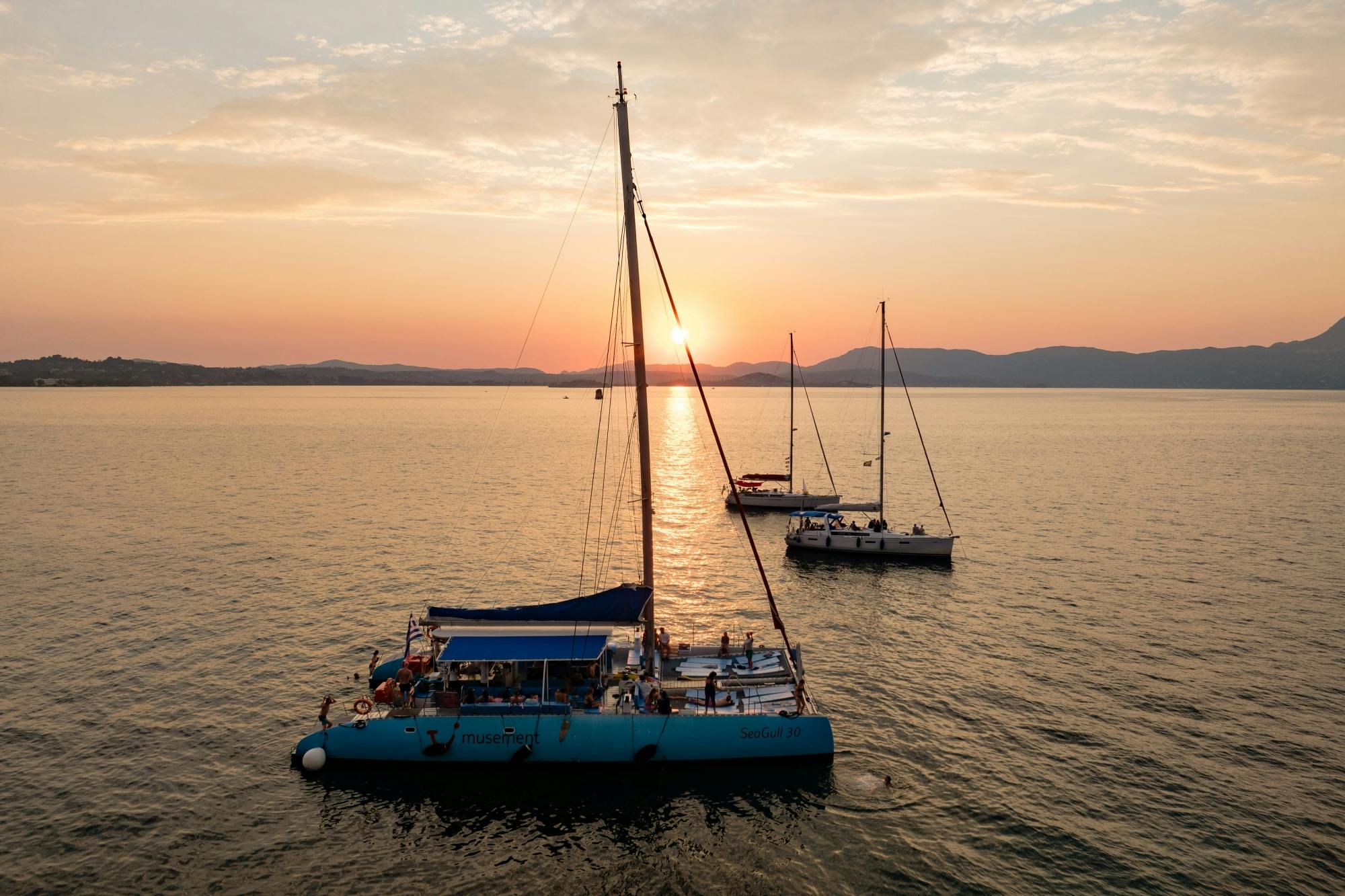 Adults-only Corfu sunset catamaran cruise with drinks, dinner and optional transfers