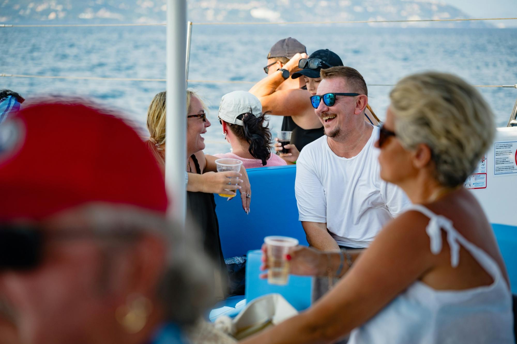 Corfu east coast catamaran cruise with drinks, meal and optional transfers
