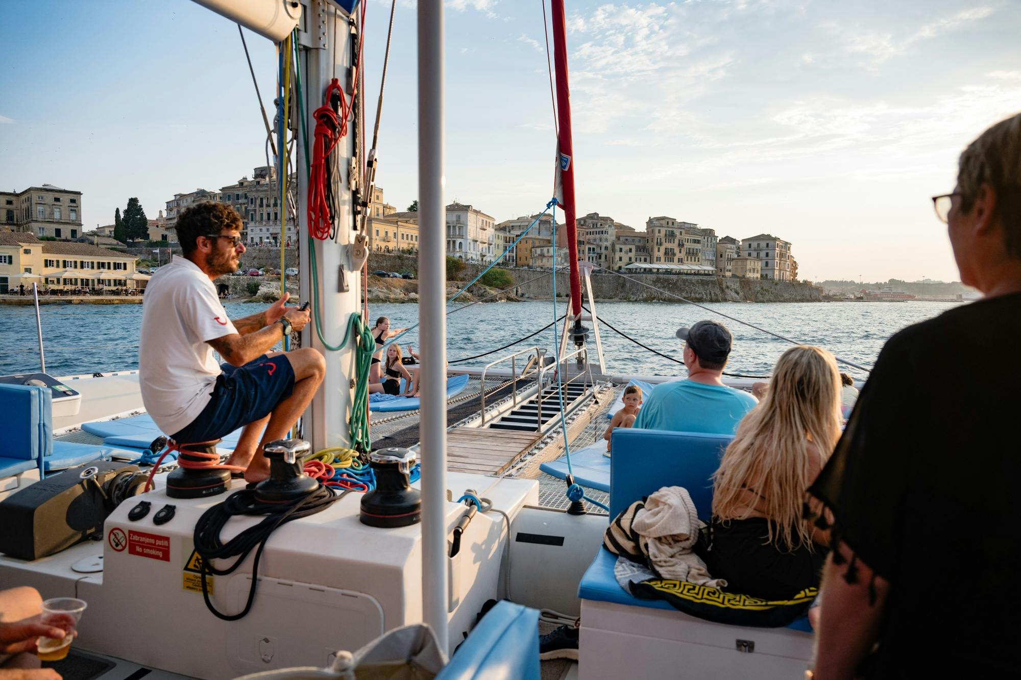 Corfu east coast catamaran cruise with drinks, meal and optional transfers