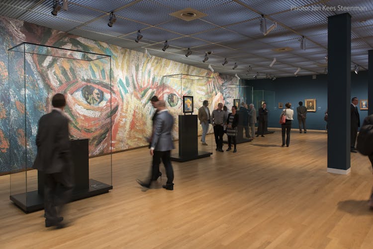 Van Gogh with photo credits inside museum with vitrines