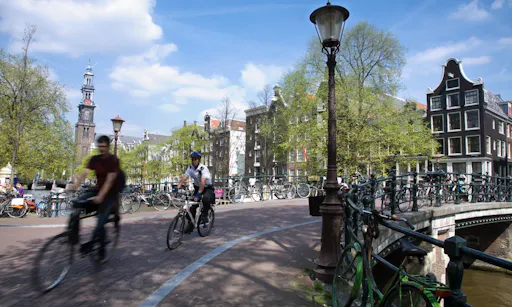 Amsterdam bike tour bikers on bridge.jpg