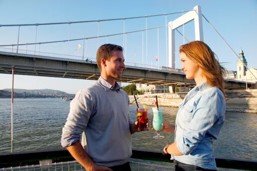 Budapest cocktail cruise couple and drinks.jpg