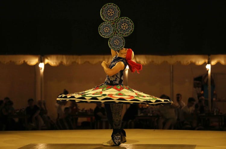 Red dunes desert safari with BBQ dinner and Tanoura dance show at Al Khayma Camp