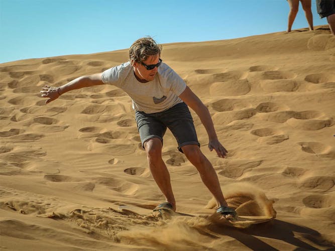 Abu Dhabi desert safari with BBQ, camel ride and sandboarding