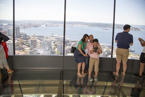 Family enjoys The Loupe - the world's first revolving glass floor. Courtesy of John Lok and Space Needle LLC.jpg