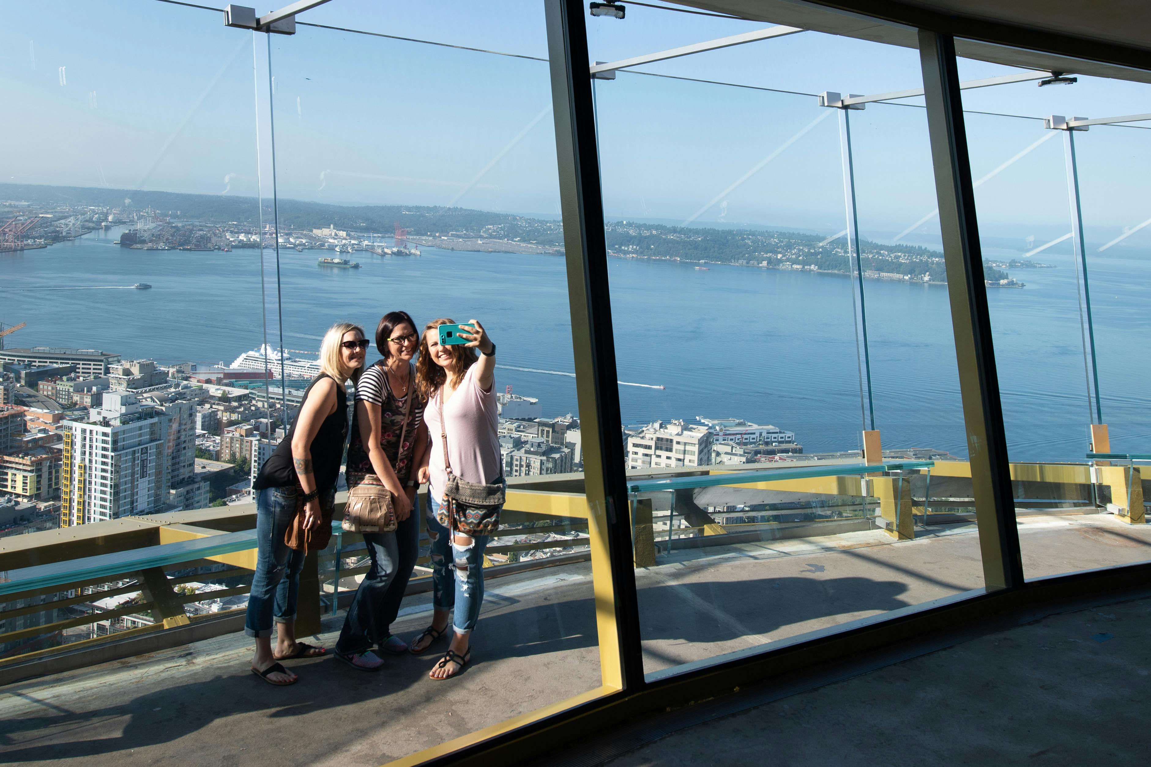 Guests take a selfie on the Space Needle’s open-air observation deck, located 520-feet in the air.JPG