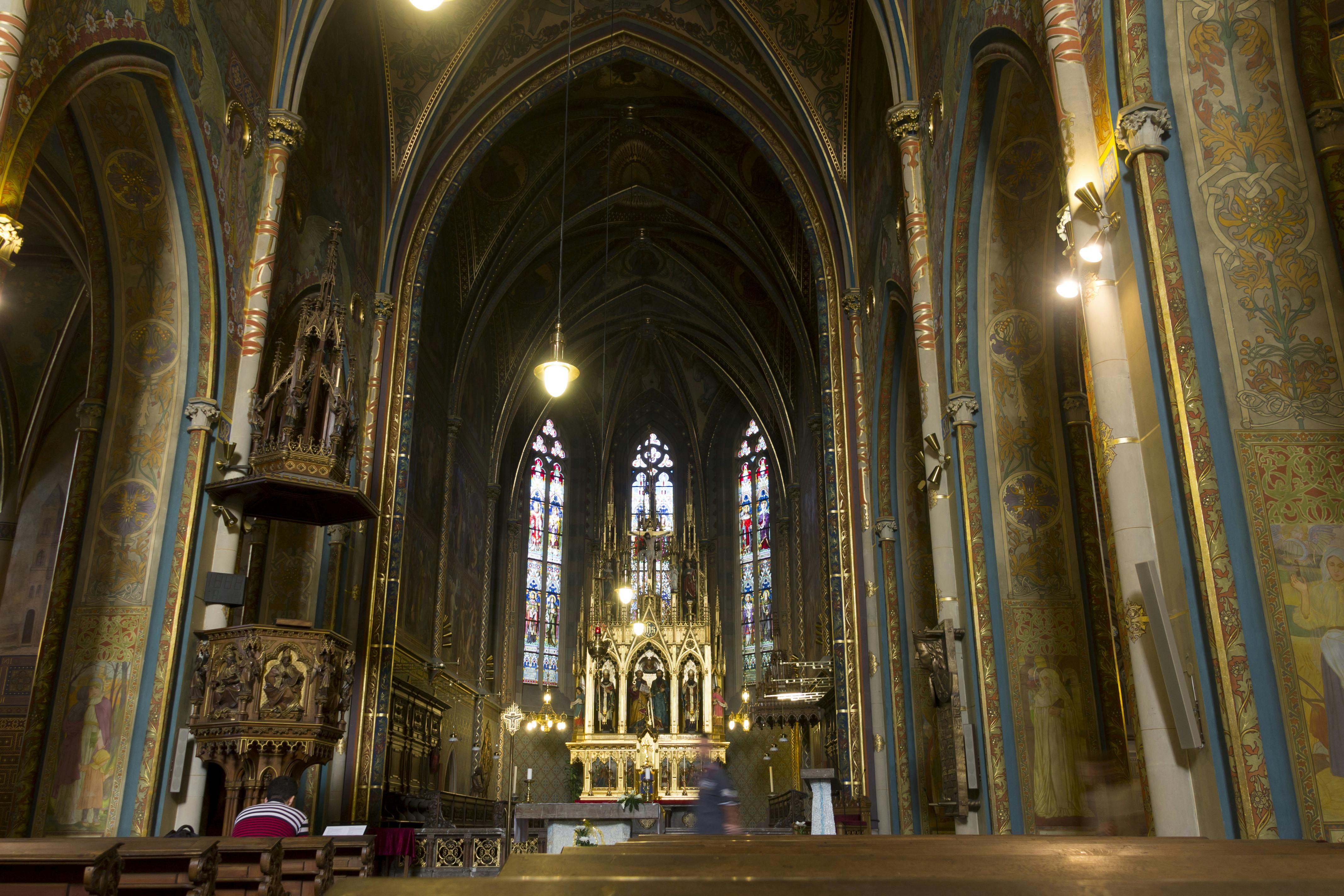 Interior of the Church (Basilica) of St Peter and St Paul at Vysehrad, Prague, Czech republic. The church harbors beautiful detailed decorative painting, a golden altar and beautiful sculptures.jpg