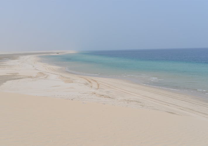 Doha desert safari, camel ride, sandboarding and Inland Sea