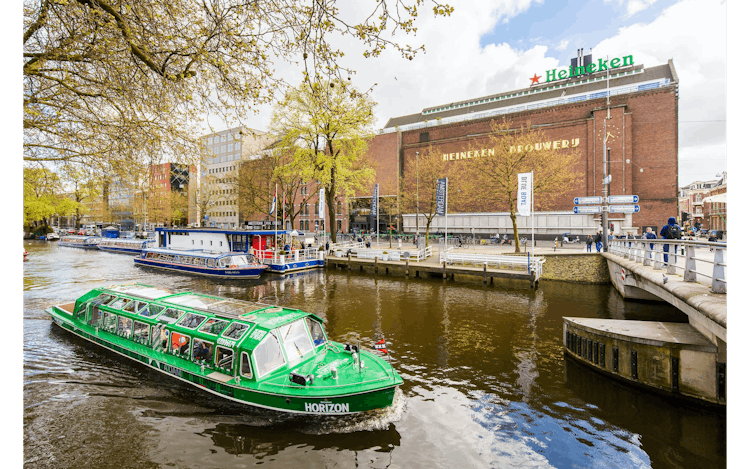 Amsterdam city canal cruise with snackbox and Heineken Experience ticket