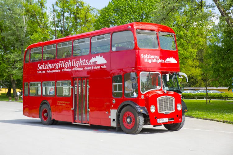 Boat trip to Hellbrunn Palace with trick fountain and London double-decker bus