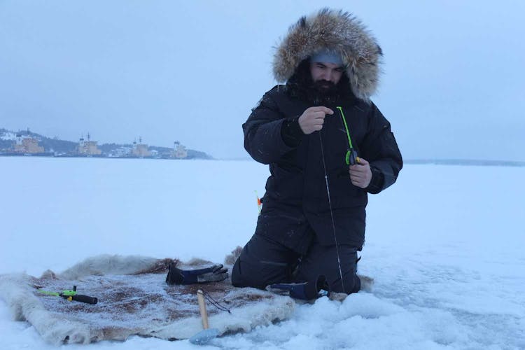 Guided ice fishing experience in Luleå