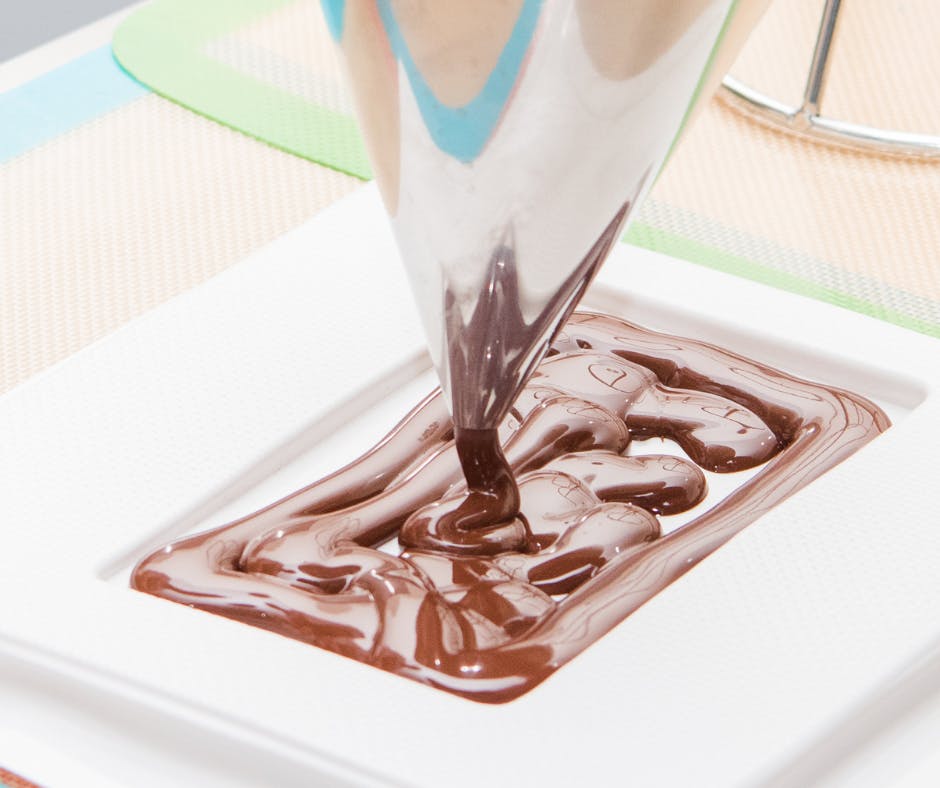 11 pouring melted chocolate into a mould.png