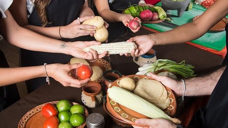 Mexican cooking class and local market guided tour with transportation in Cancun