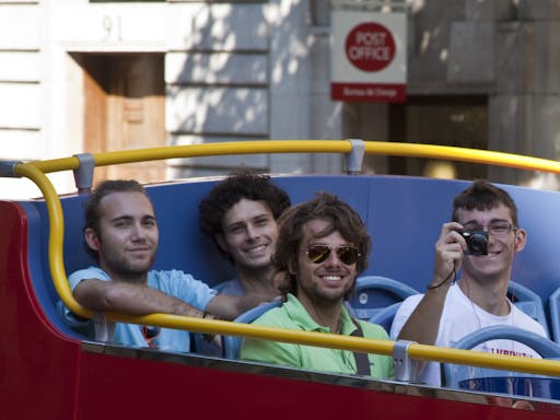 Customers on hop on hop off bus with camera in London.jpg