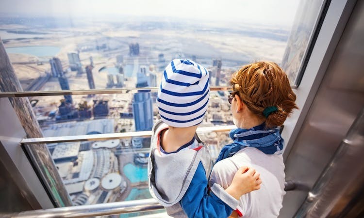 burj-khalifa-tickets-mom-child-looking-down_header-25884.jpeg