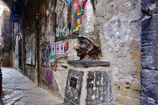 6. Via dei Tribunali, Sculpture of Pulcinella_AdobeStock_386637299.jpeg